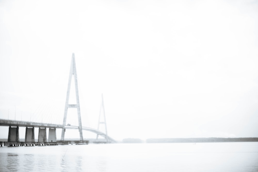 gray concrete bridge under cloudy sky