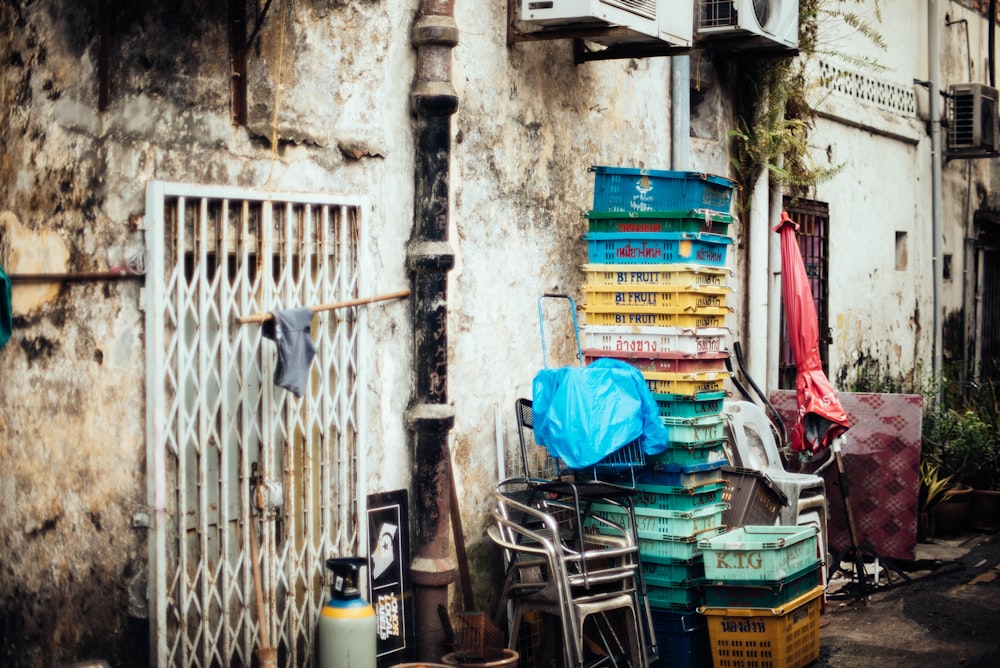 laundry basket stacked beside wall