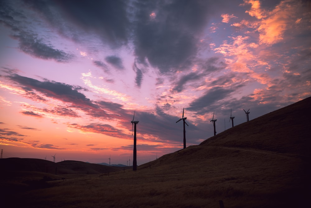 wind turbines under clear blue sky