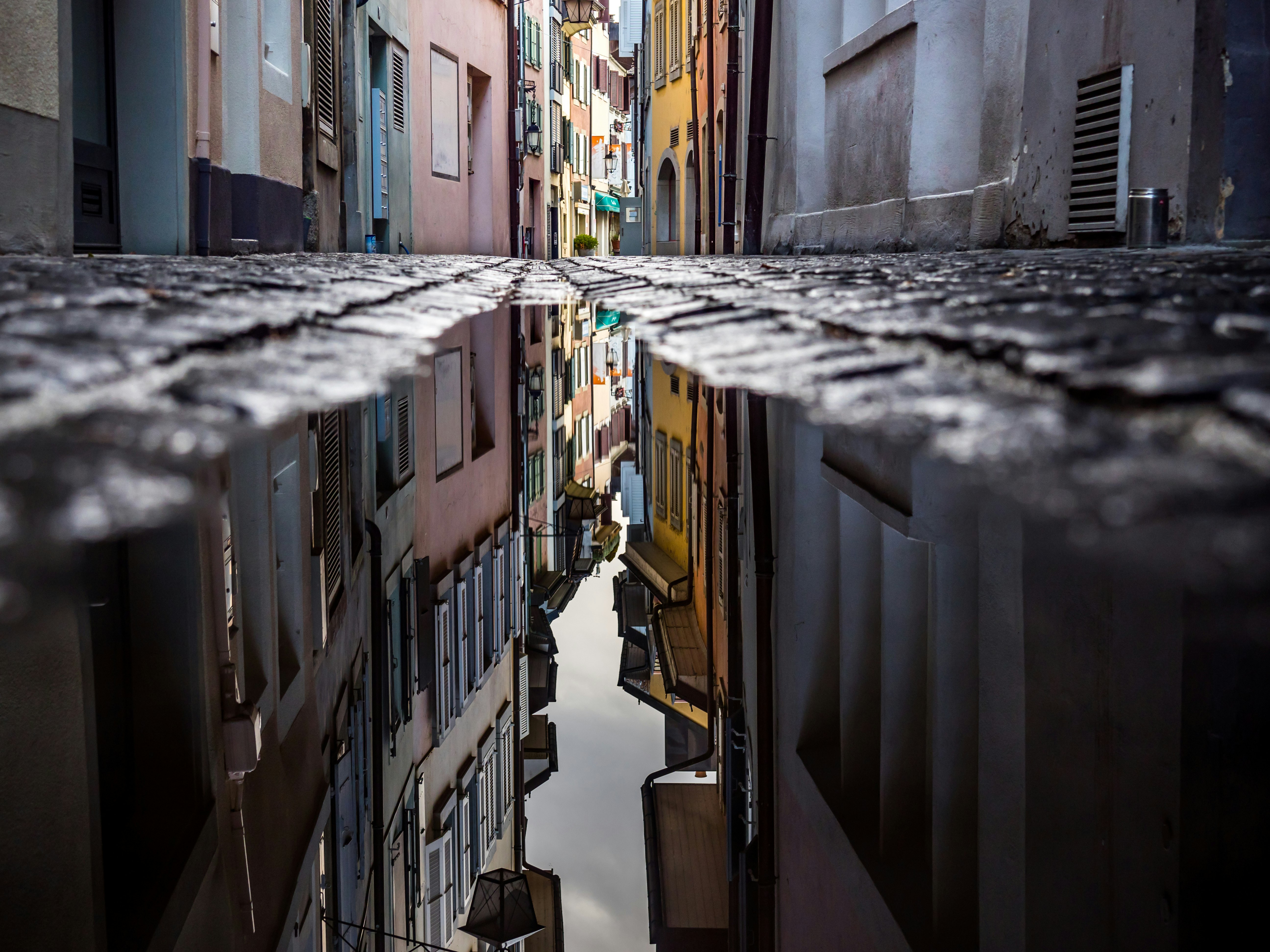 worm's eye view of pathway between houses