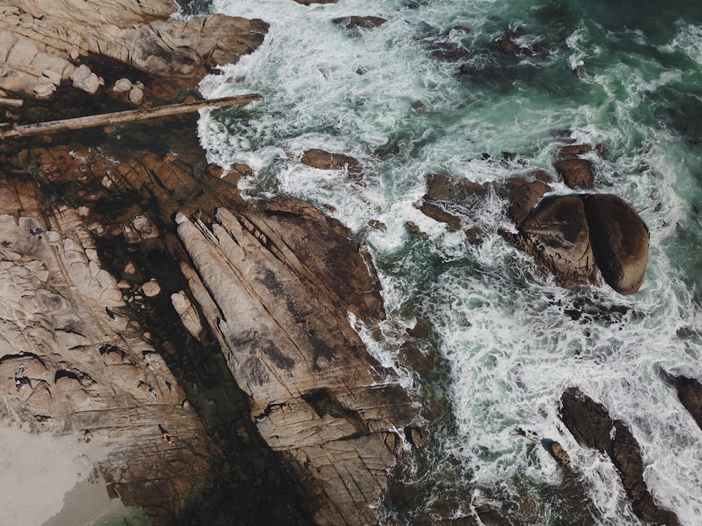 aerial photography of cliff near body of water