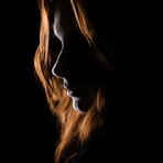 woman's face on black background