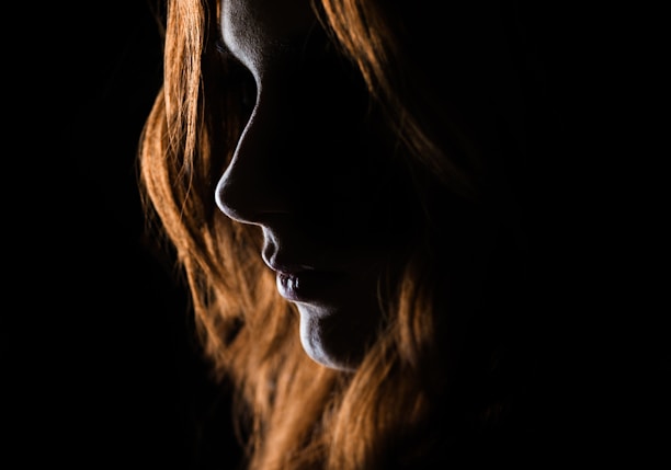 woman's face on black background