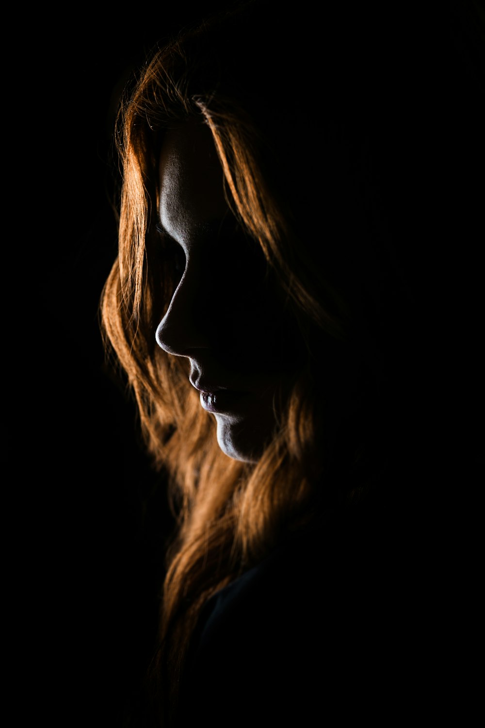 woman's face on black background