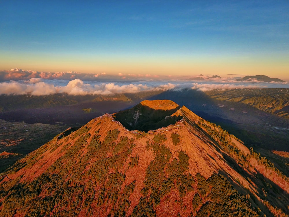 brown and green mountain under blue clear sky during daytime