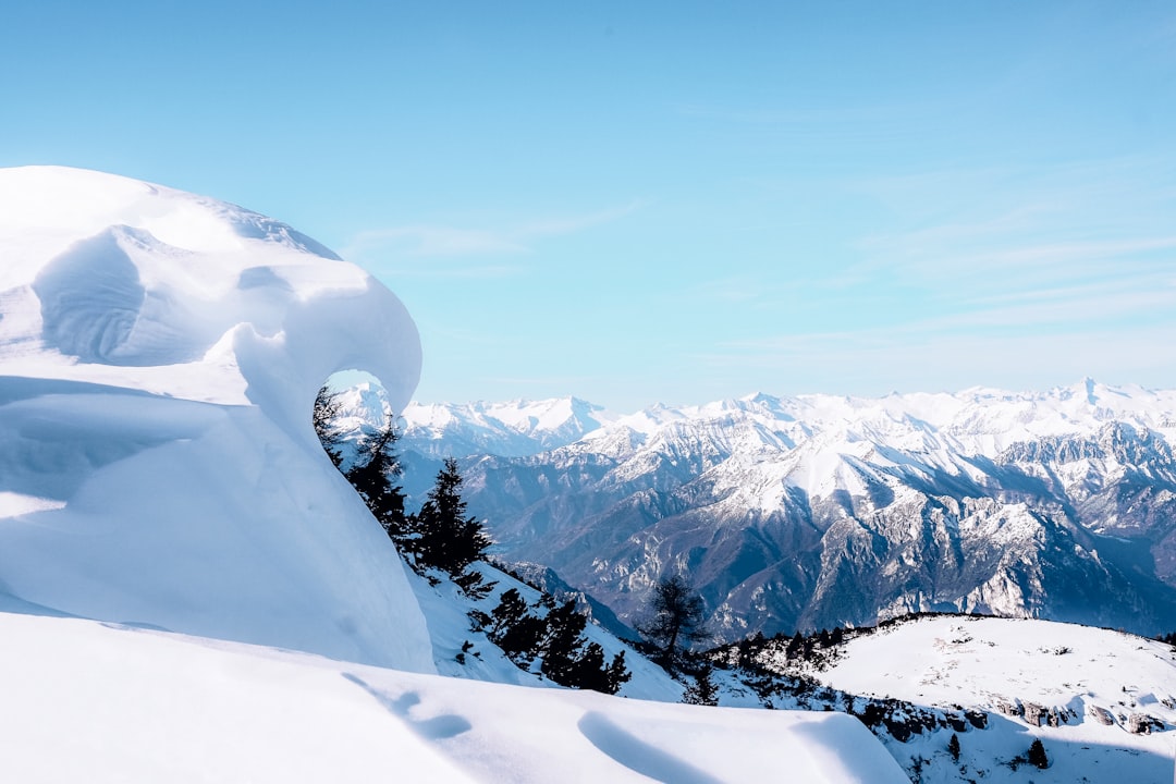 snow-covered mountain under blue sky