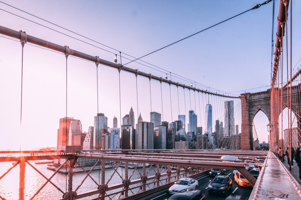 vehicle speeding on brown metal bridge