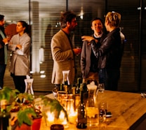 five person standing while talking each other