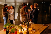 five person standing while talking each other