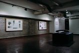 A well-lit gallery corner featuring popular items and their details.