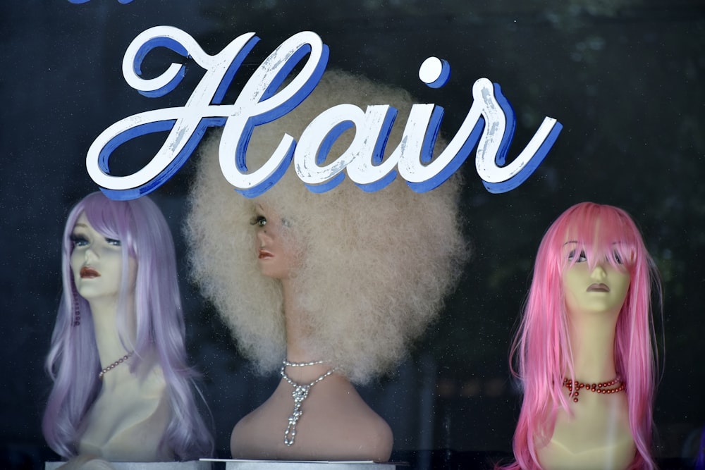three assorted-color hair wigs