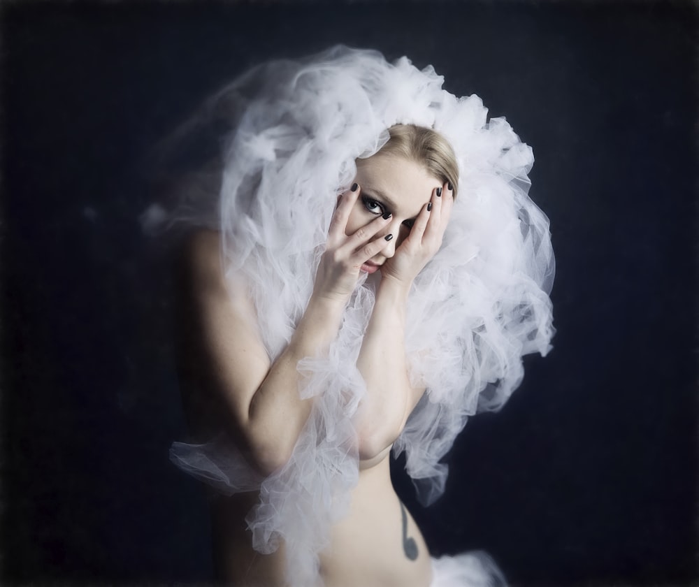 topless woman covered with smoke in black background