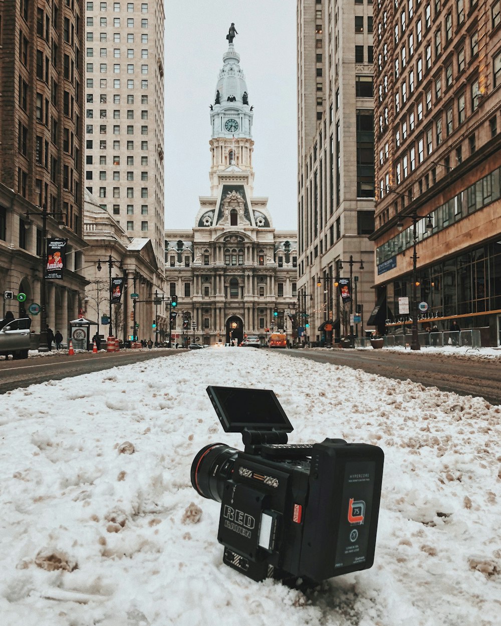 black video recorder on snow ground