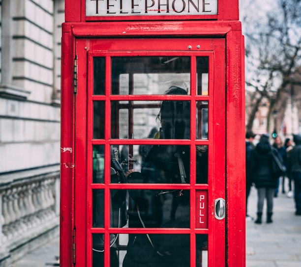 closeup photo of red telephone booth