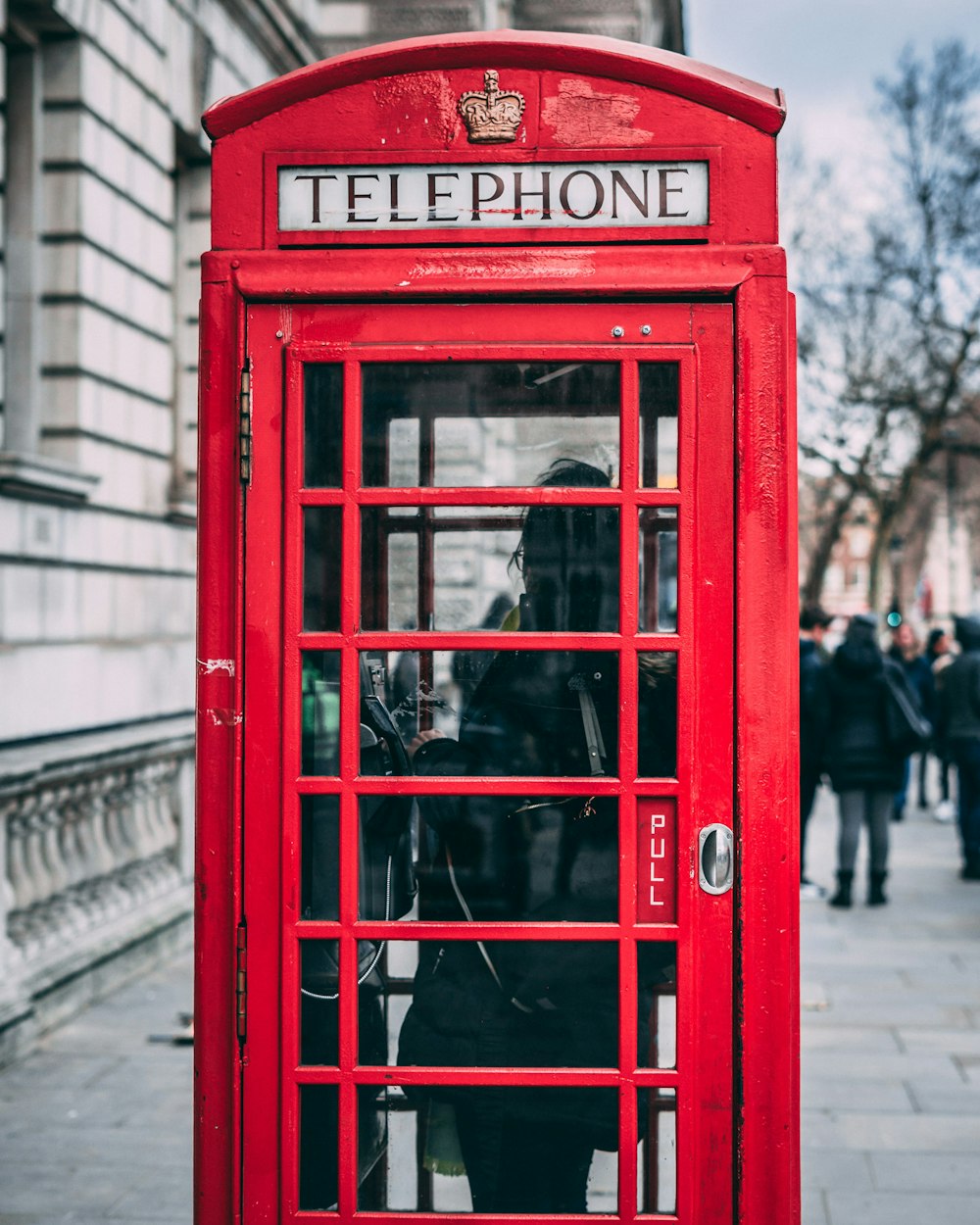 closeup photo of red telephone booth