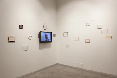 Minimalist gallery wall displaying framed prints of graphic and video projects.