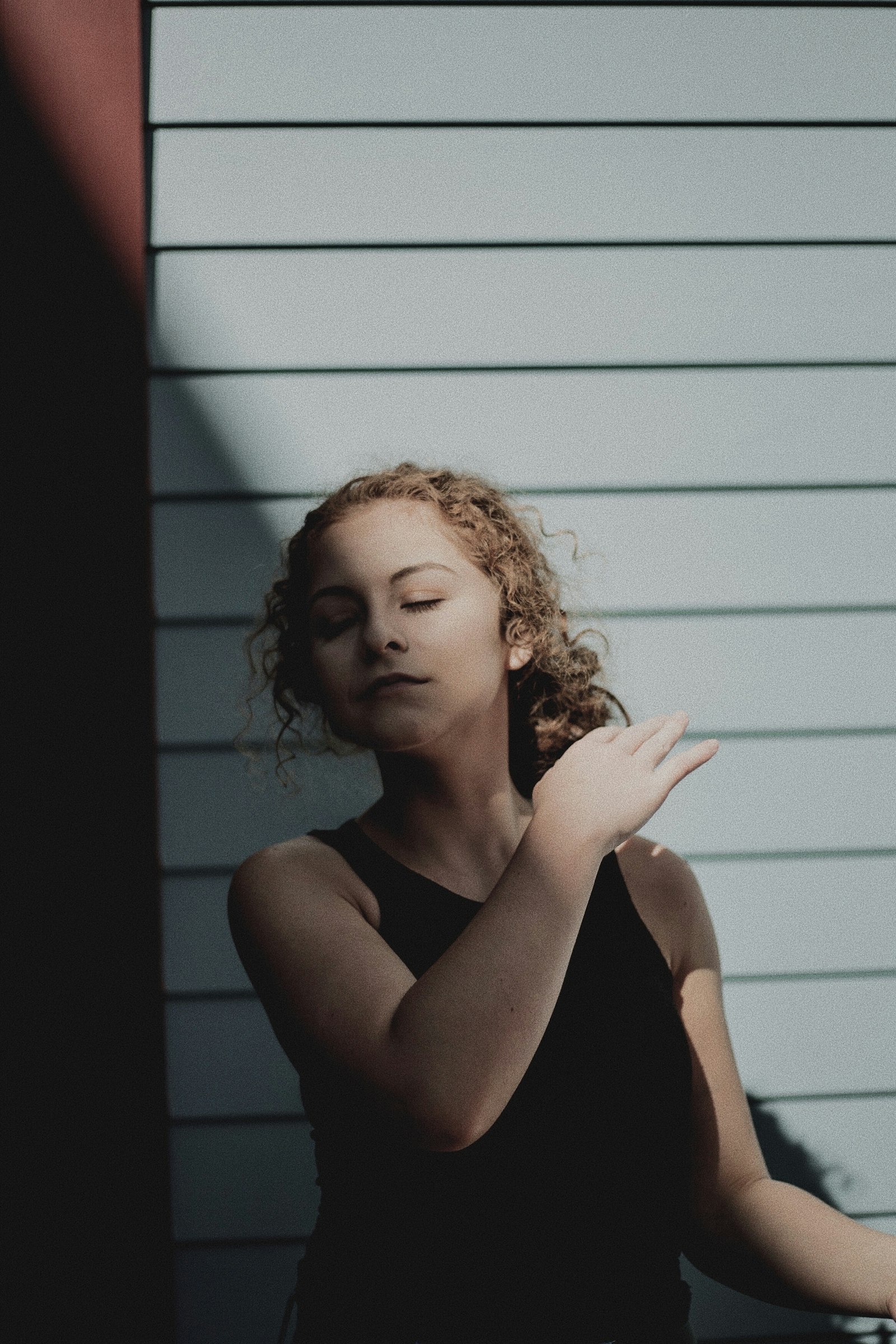 Canon EOS-1D Mark II N sample photo. Woman meditating near wall photography