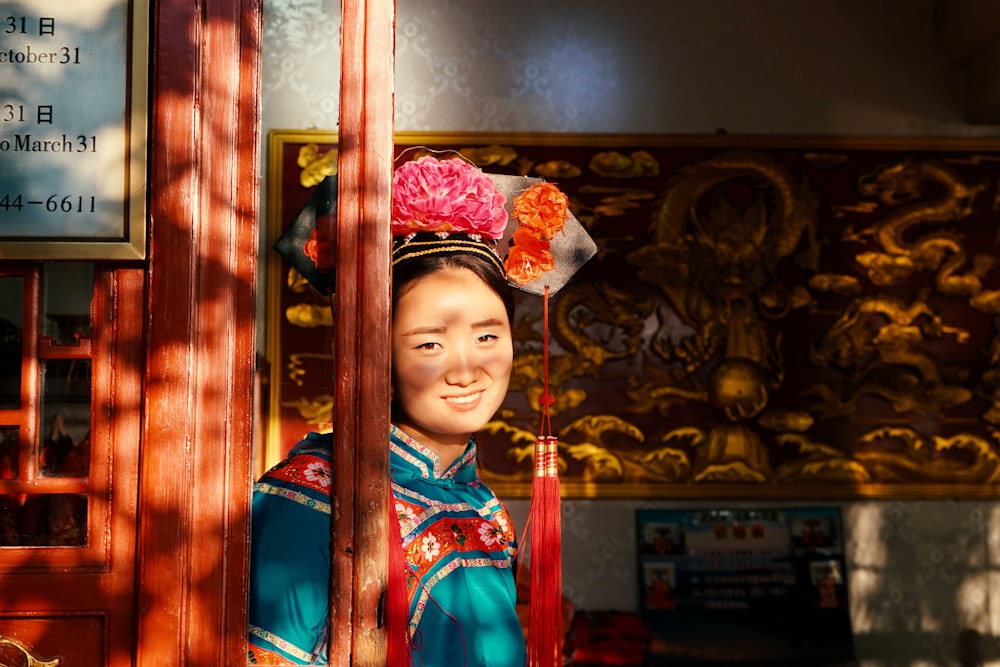 woman leaning on brown wooden wall at daytime