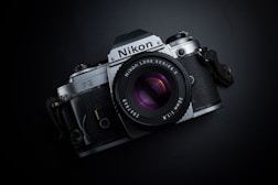 black and gray Nikon camera
