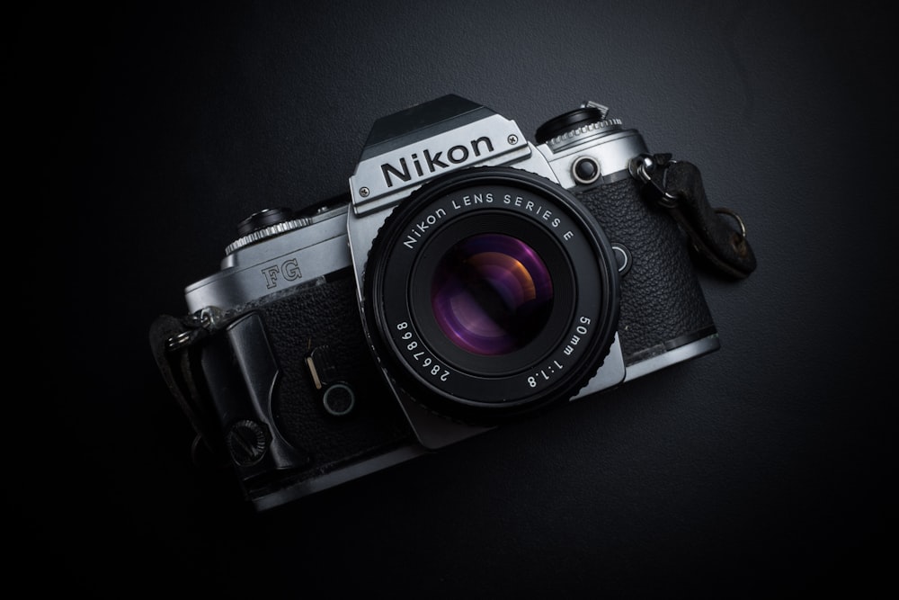 black and gray Nikon camera