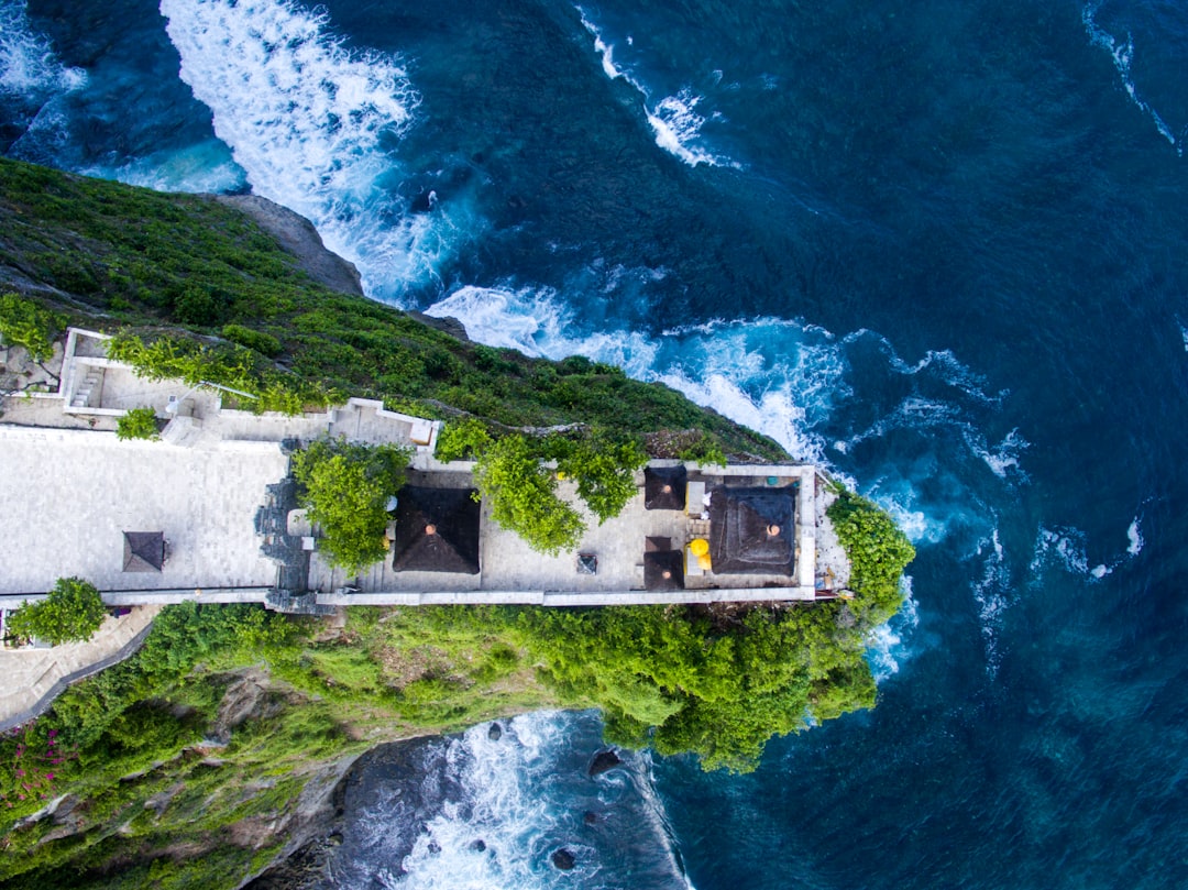 aerial shot of cliff near body of water