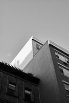 An architectural photo before and after perspective correction and shadow balancing.