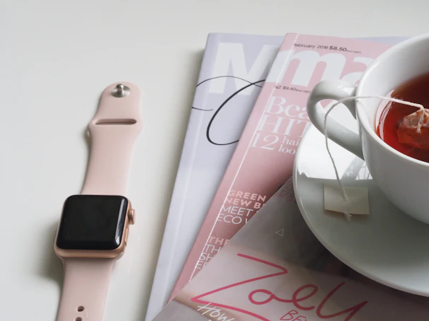 The Ringconn Gen 2 smart ring resting beside a cup of tea and a journal, symbolizing stress and wellness tracking.