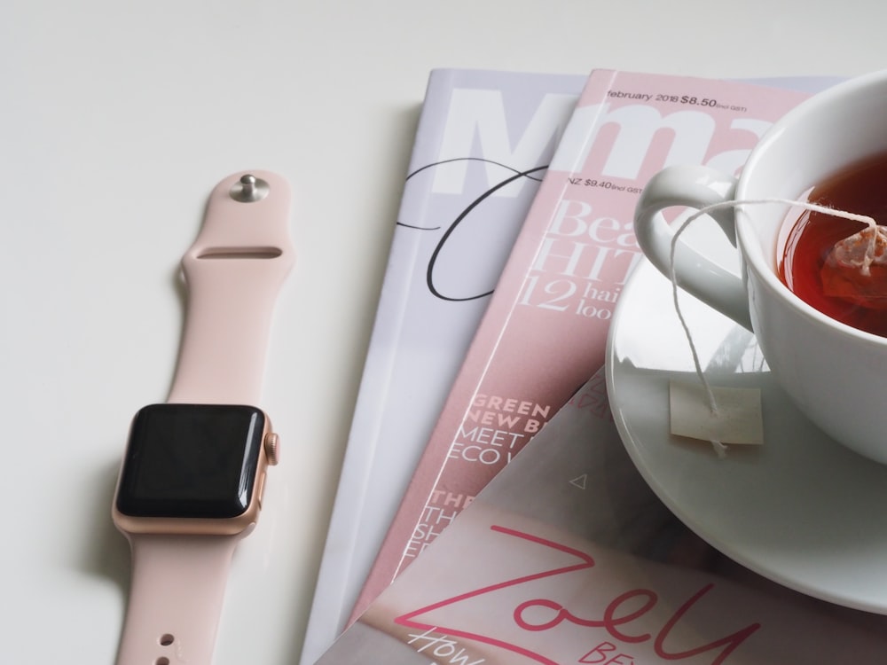 smartwatch near three books