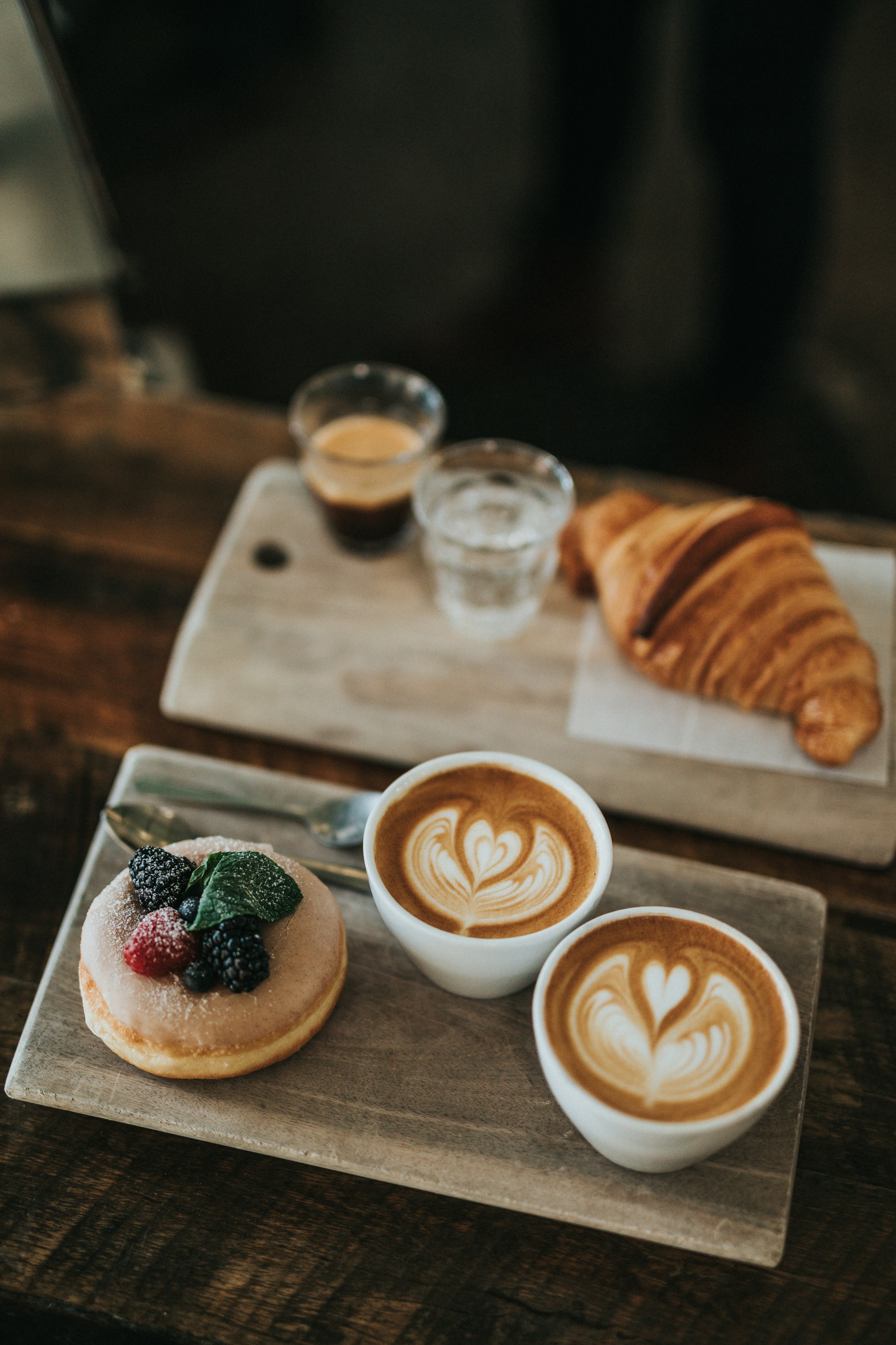 Coffee and pastry on wooden table