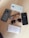 The image displays several smartphones, glasses, and sunglasses arranged on a wooden surface. The phones include brands like Motorola, Oppo, and Vivo.