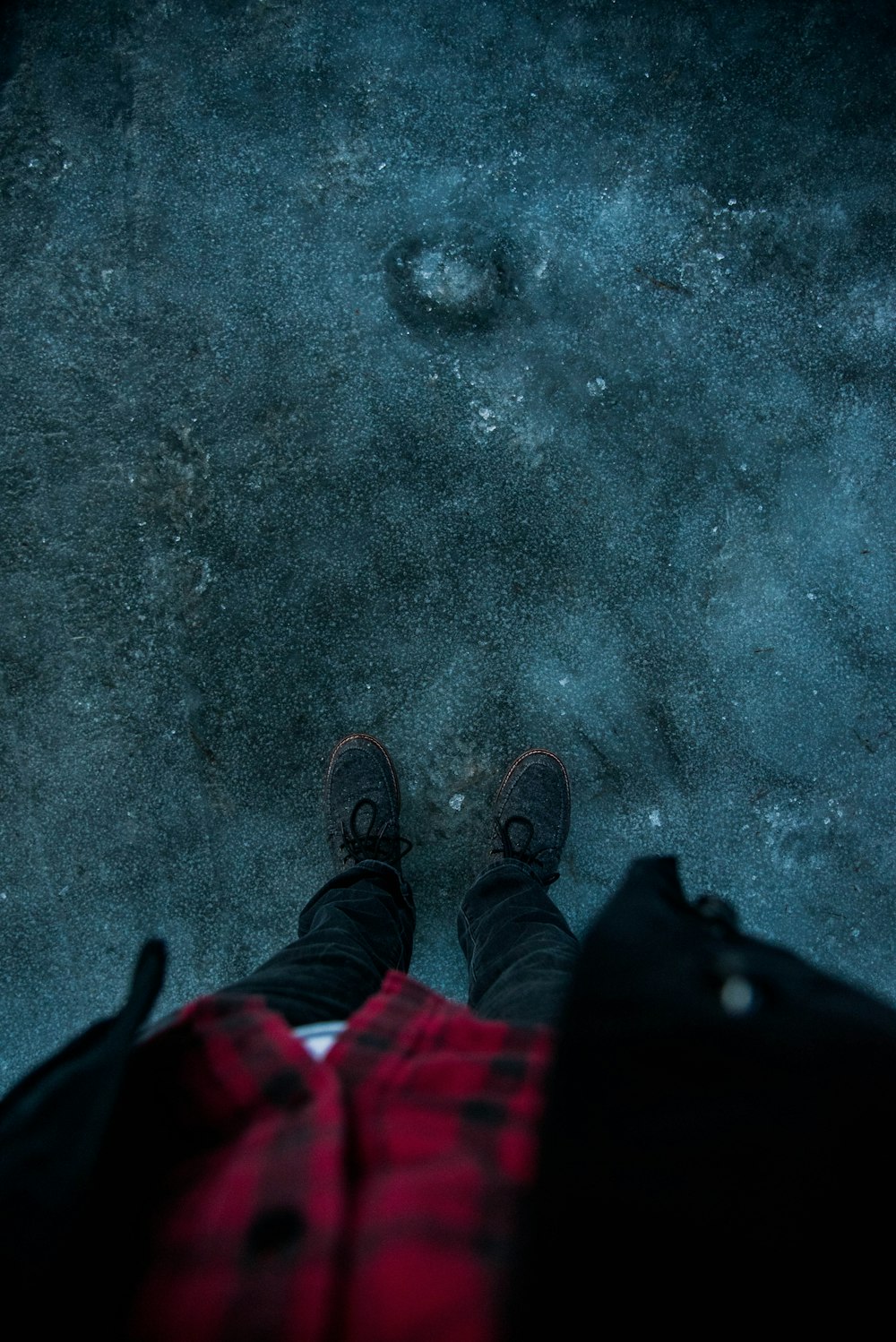 photo of person standing on pavement
