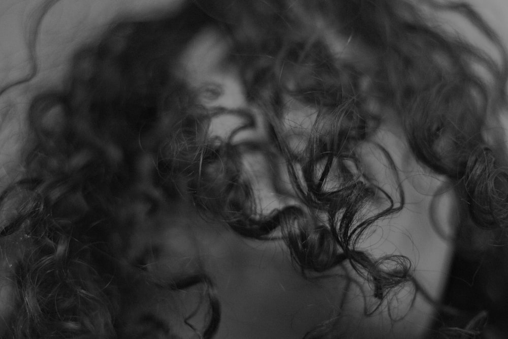 grayscale photo of curly hair wig
