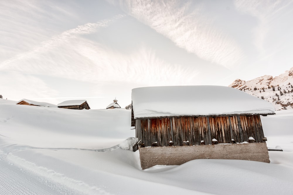 photo of shed covered with snow