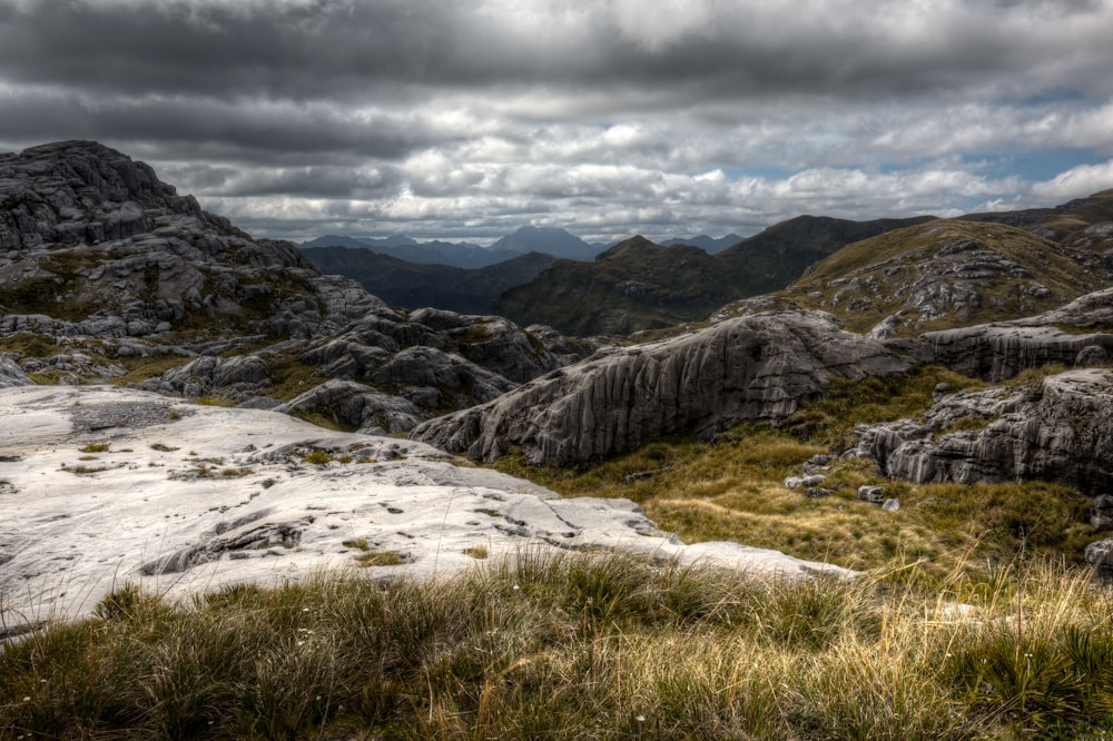 mountains under cloudy sky