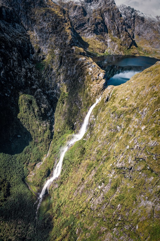 top view of lake with waterfalls in Sutherland Falls New Zealand