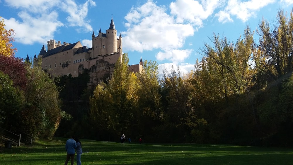 couple looking at brown castle