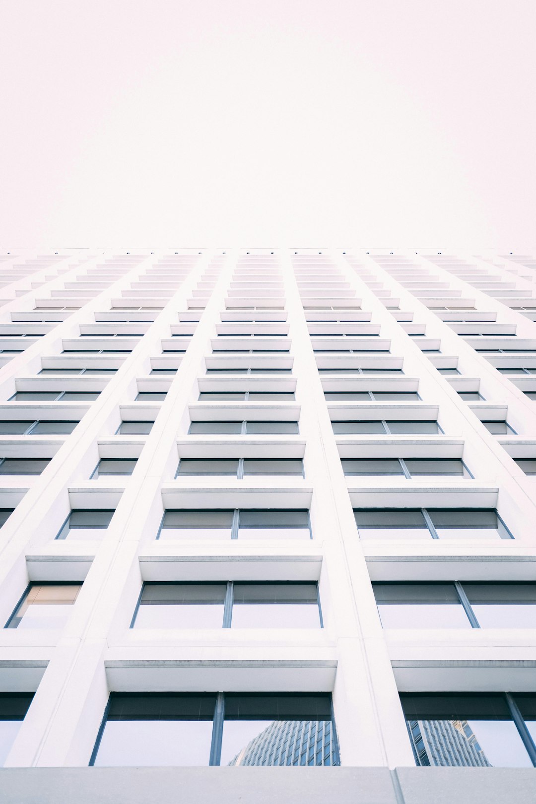 low-angle photography of white concrete building