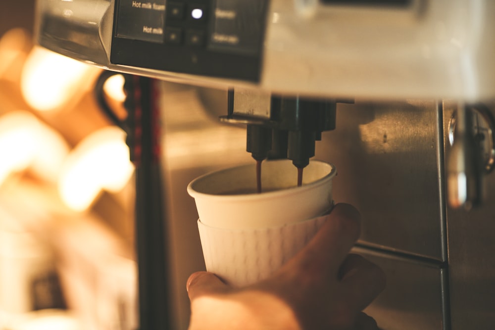 person preparing coffee