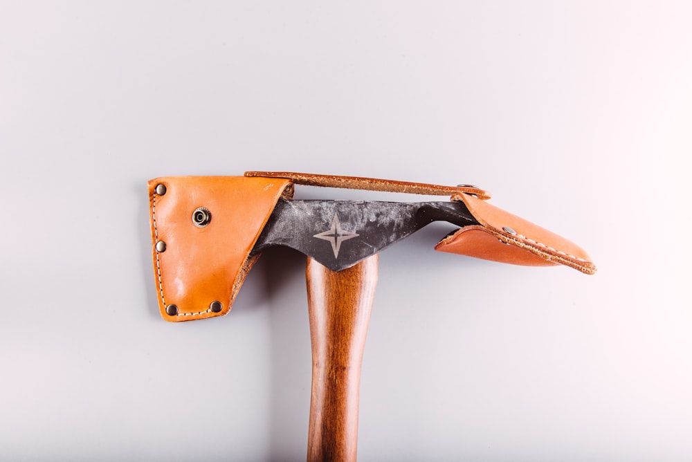 black hatchet with leather case