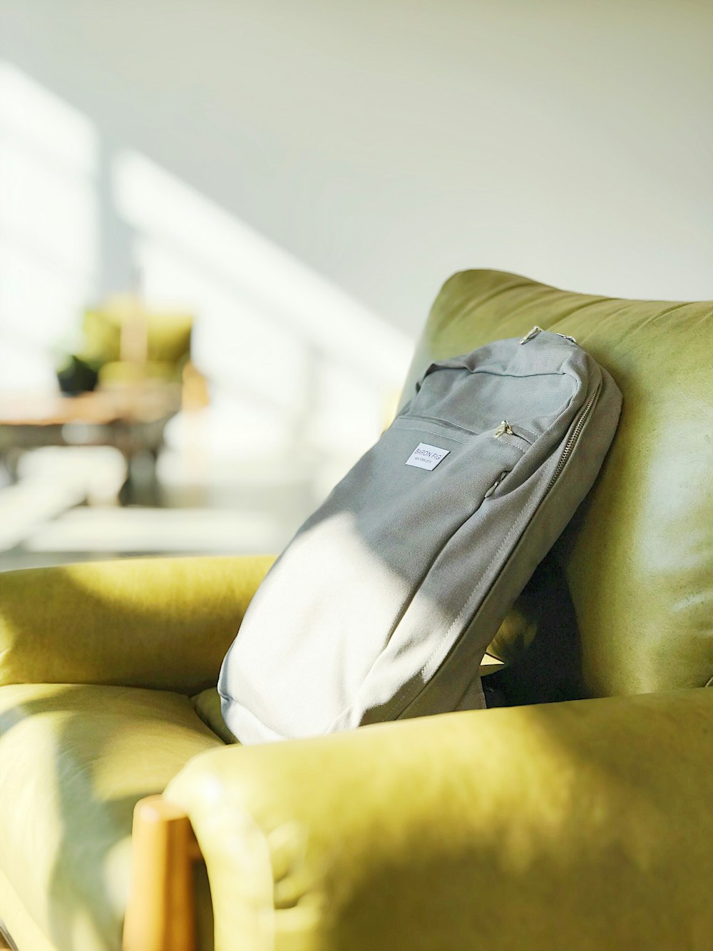 grey bag on sofa