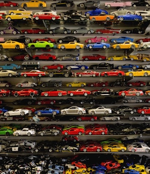 die-cast car collection on rack