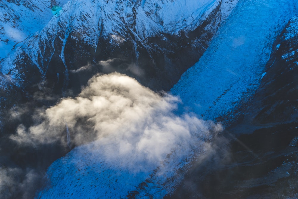 white clouds on mountain