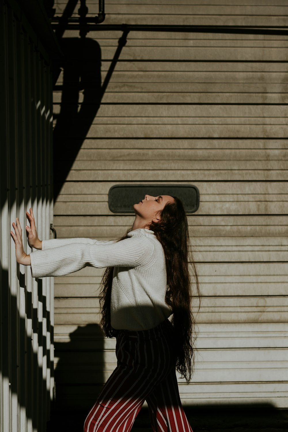 woman holding galvanized iron sheet