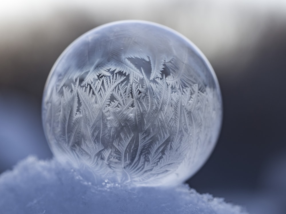 shallow focus photography of clear water globe