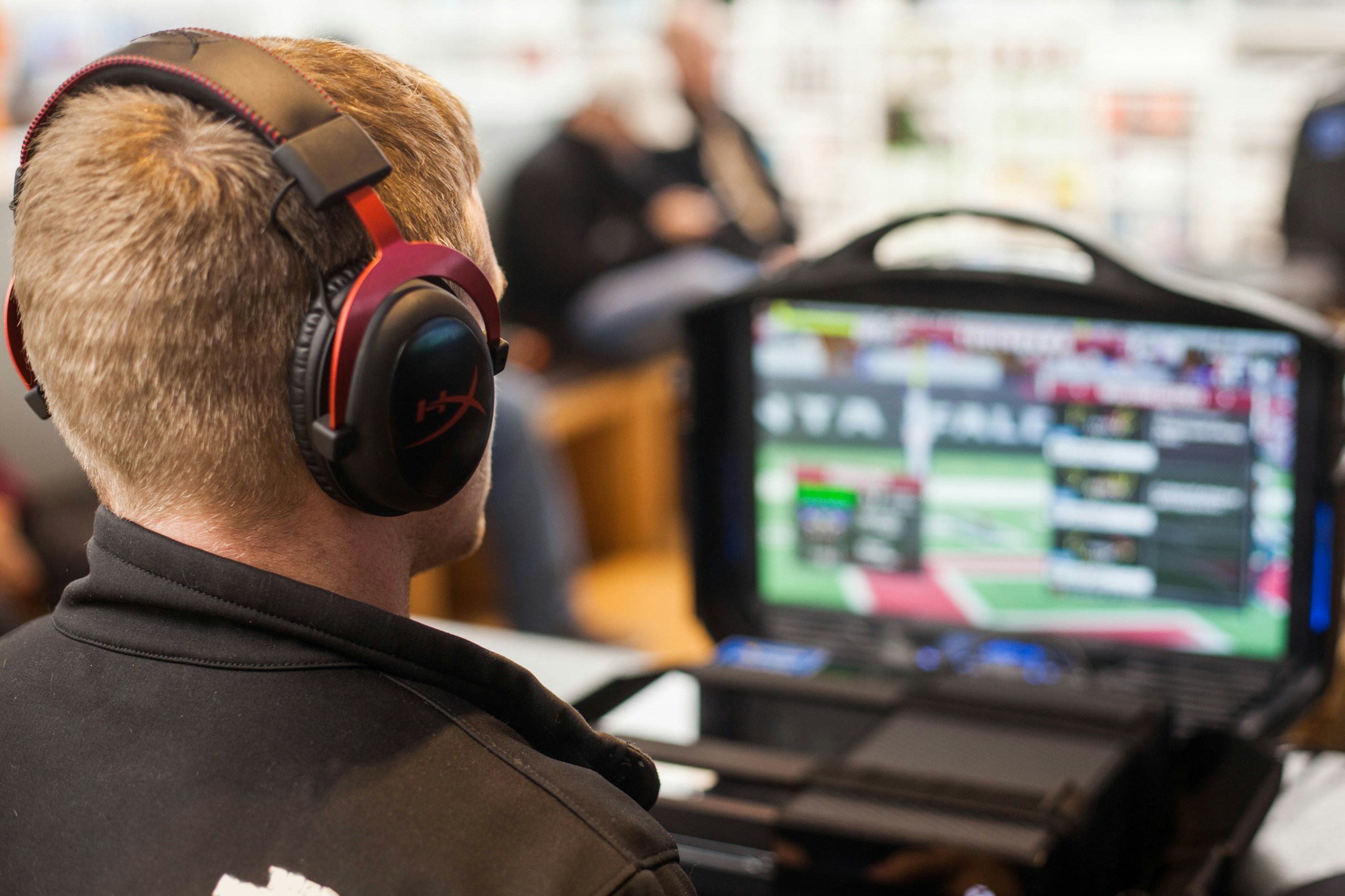 Madden, man watching computer game