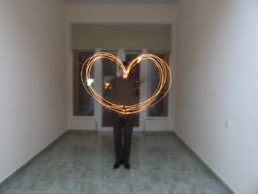 steel wall photography of standing man inside white room