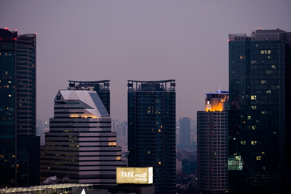 city skyline under cloudy sky during daytime