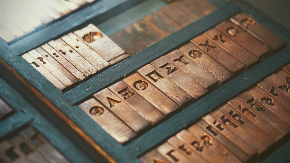 brass letter plates in black wooden box