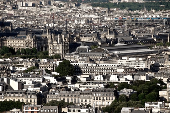 A bustling downtown area with modern buildings and green spaces blending seamlessly.