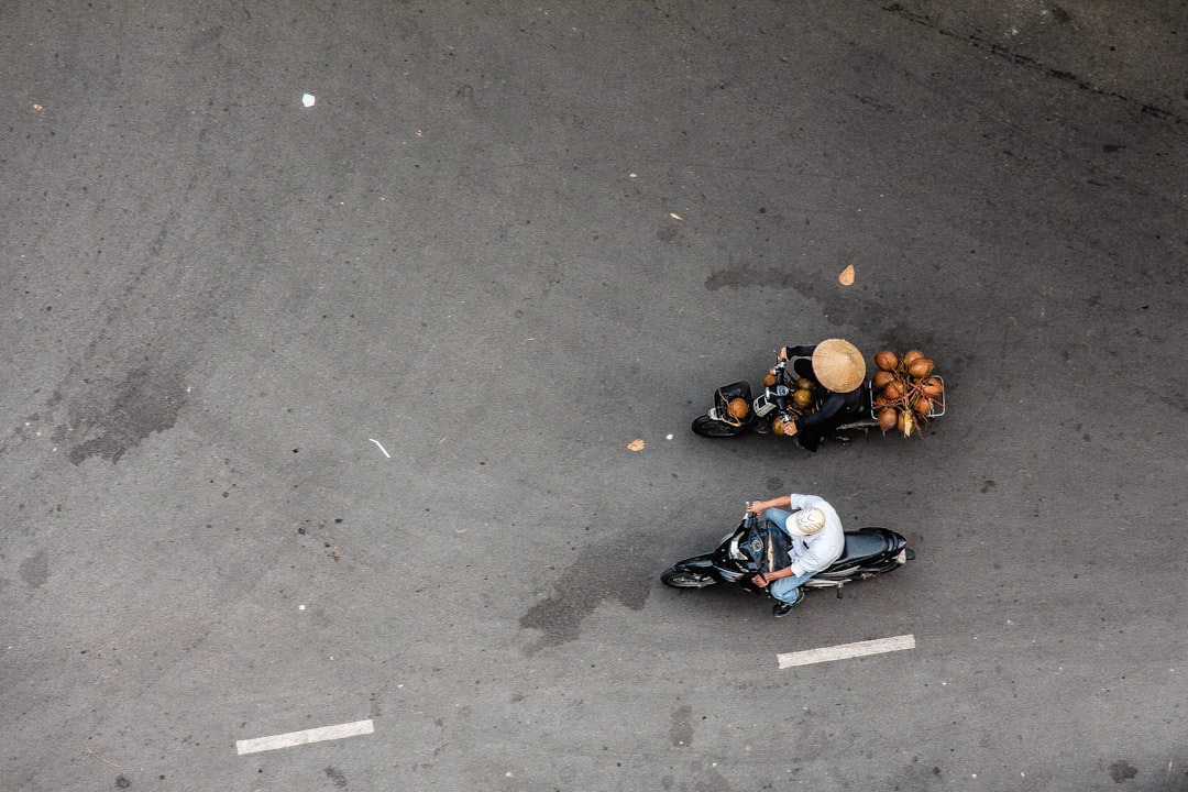 I spent some time at a friend’s apartment taking overhead photos of motorbikes driving by & caught this wonderful shot.